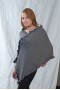 Channeled poncho with V-formed neck and ruffles