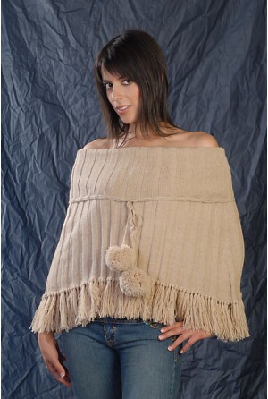 Channeled poncho with high neck and pompons on it