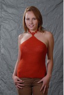 Orange top with crochet flowers on the neck