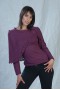 Jersey sweater with a small cape on and crochet spray