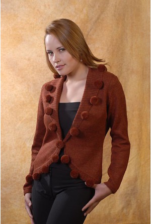 Coat with tuxedo-like neck and pompons on it