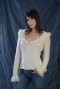Coat with zipper and round neck with fringes on it and on the wr